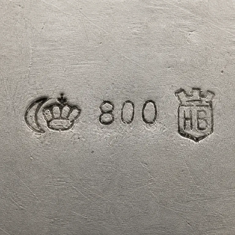 Robert Altermann: Crescent, crown, 800, and castellated HB shield in source order; oxidized reconstruction.