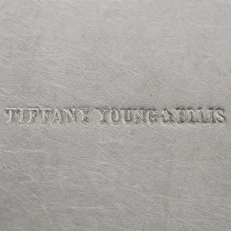 Tiffany, Young & Ellis: TC; oxidized reconstruction.