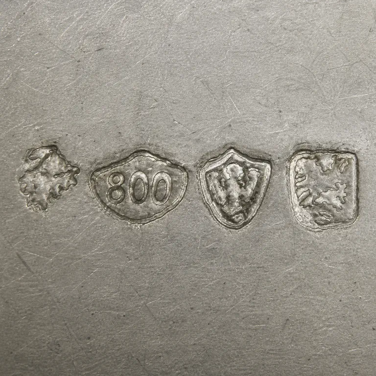 Julius Lemor: Four punches, 800 oval, and two bordered abstract emblems; oxidized reconstruction.