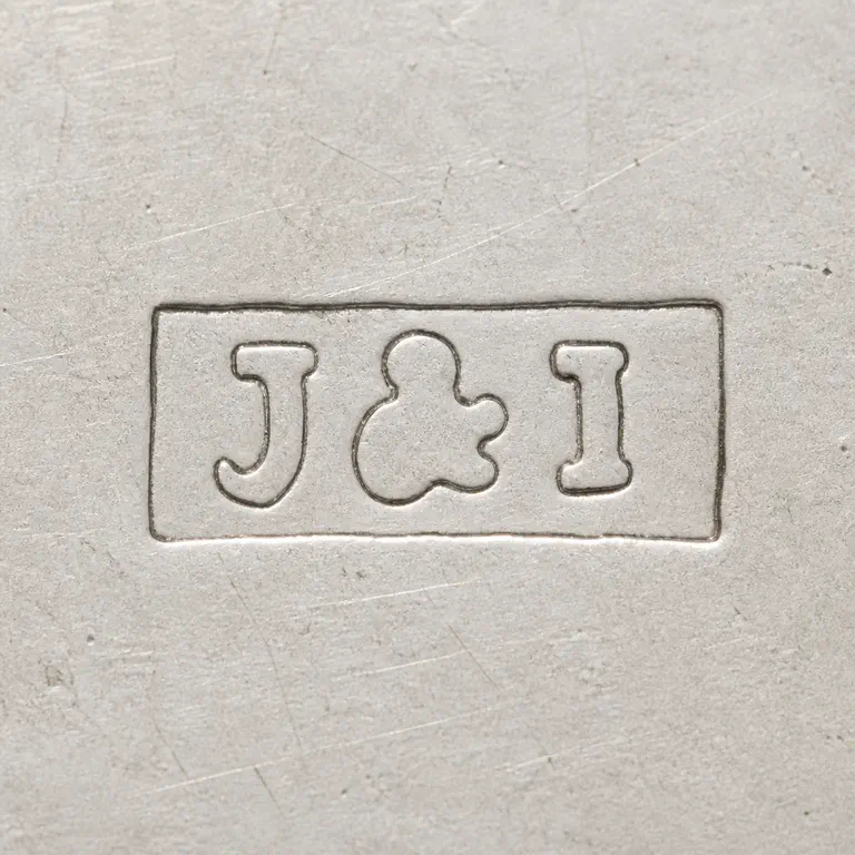 J & I: Compact J-like, separator-like, and I-like forms are reconstructed inside the local rectangular boundary in source order; oxidized reconstruction.