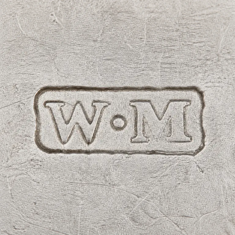 William Maguires: W M arranged left to right inside one compact worn rectangular cartouche; oxidized reconstruction.