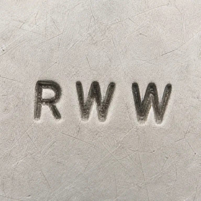 R W Wingate Ltd: Three visible capitals R W W in left-to-right order with no enclosing border supported by the source; shapes and spacing are retained; oxidized reconstruction.