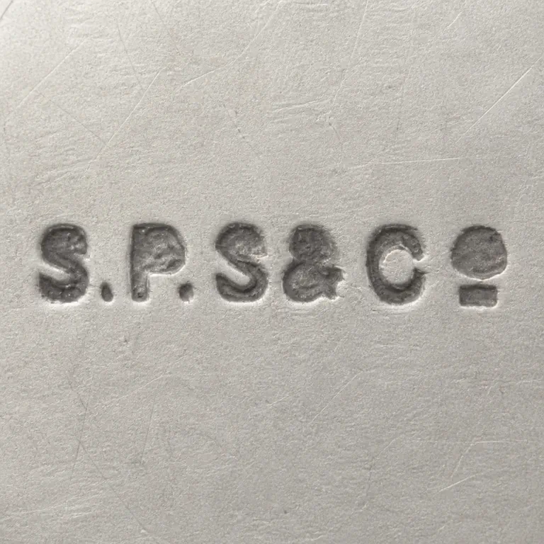 S P S & Co: Square contour reconstruction preserves the long separated S/P/S/ampersand-like/C group and left-to-right order; oxidized reconstruction.