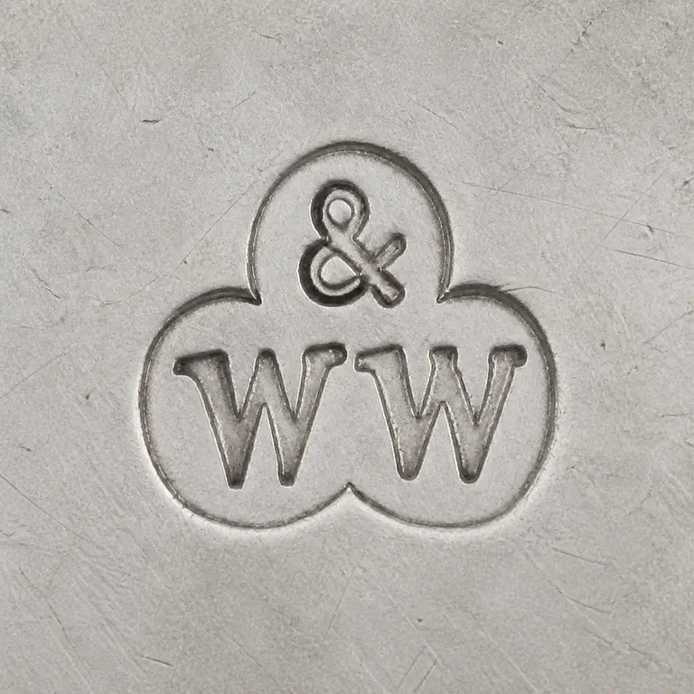 Wakely & Wheeler Sterling Quaich, 1934 London retailed by A & J. Smith…: One ampersand in a small upper round lobe above uppercase W and uppercase W in two joined lower lobes, all forming one coherent three-lob…; oxidized reconstruction.