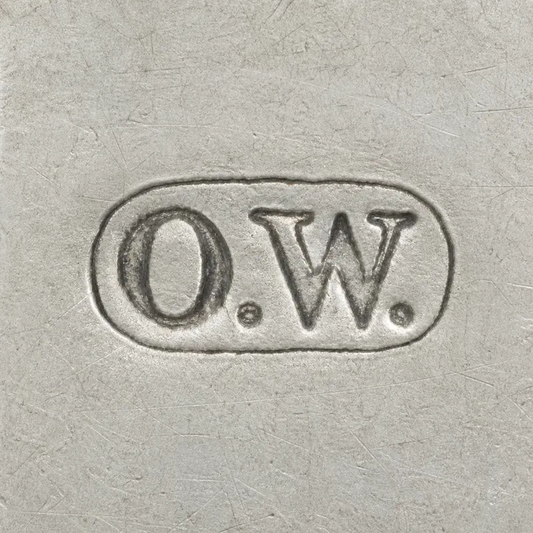 O.A.: Reconstruction preserves uppercase O.W. with both periods inside one horizontal oval cartouche; oxidized reconstruction.