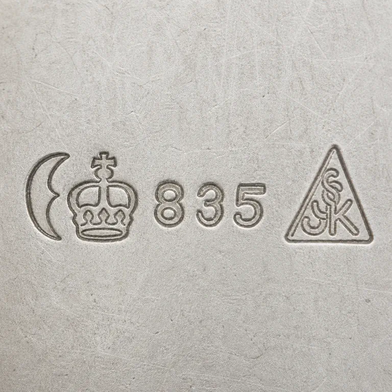 looking for info: Visible text, numerals, symbol order, and source-bounded device geometry; oxidized reconstruction.