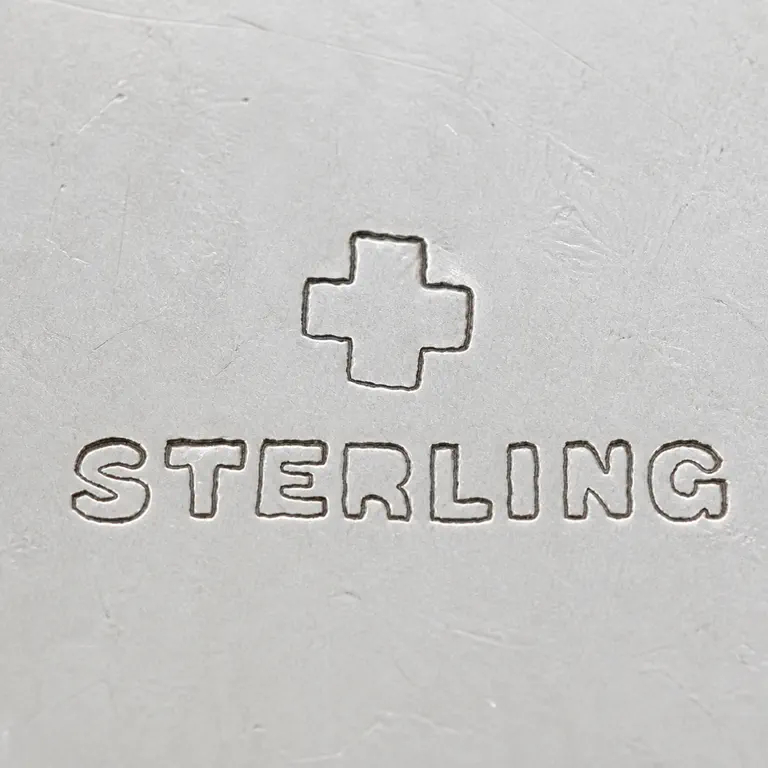 J. F. Fradley & Co.: Swiss Cross, sterling; oxidized reconstruction.