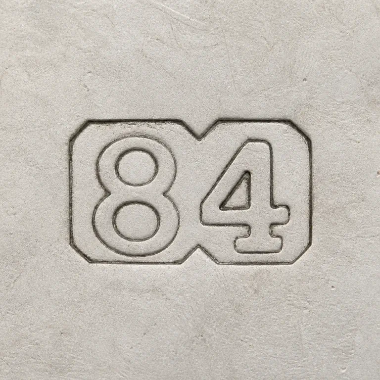 Silver Standard Mark: Two joined clipped-corner punches preserve exact 84 with 8 at left and 4 at right; oxidized reconstruction.