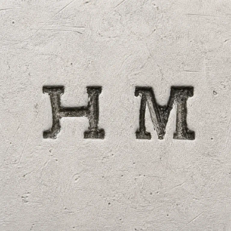 Henry Mansell: H M arranged left to right plain field without an enclosing border; oxidized reconstruction.