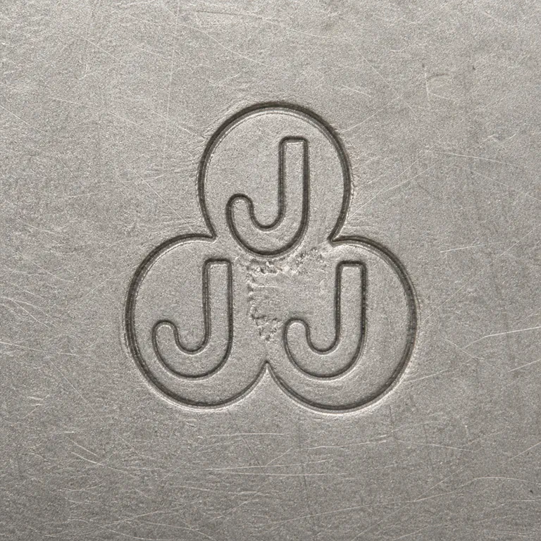 J J J: Three connected rounded lobes, one upper J-like form, two lower J-like forms, vertical order, and orientation; oxidized reconstruction.