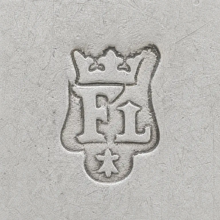 William Fleming: Outlined reconstruction of the ornate shield-like punch with crown, F/L-like central forms, and lower star/floral device; oxidized reconstruction.
