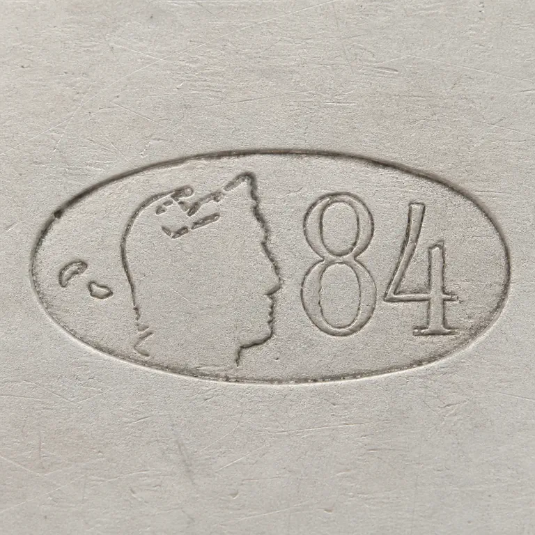 St. Petersburg: One horizontal oval with two tiny irregular curved fragments at far left, a sparse right-facing profile impression in the center, and 84…; oxidized reconstruction.