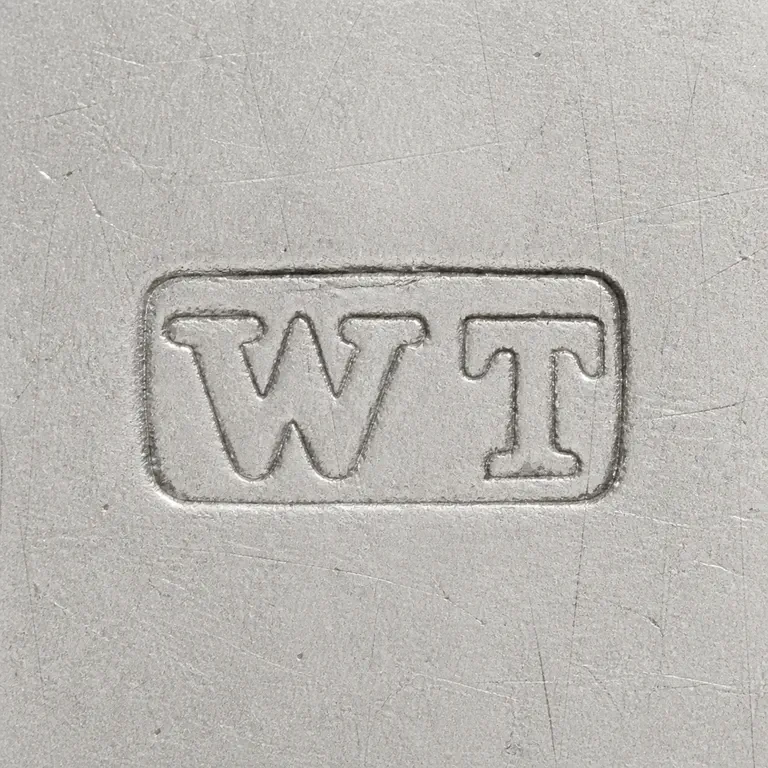 William Theobalds: Clear W.T-like pair and compact rectangular punch with dense interior relief and source orientation; oxidized reconstruction.