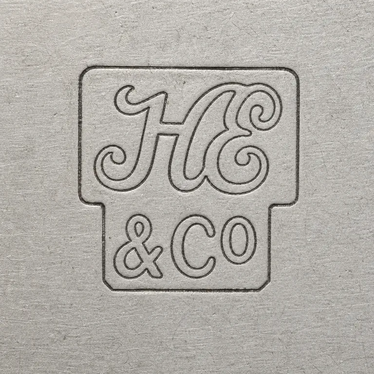 Hawksworth, Eyre & Co Ltd: Square contour reconstruction preserves the stacked framed ornate H/E-like upper group and lower ampersand/C/O-like group; oxidized reconstruction.