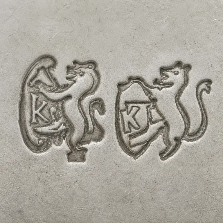 J.B. & S.M. Knowles: lion, K; oxidized reconstruction.
