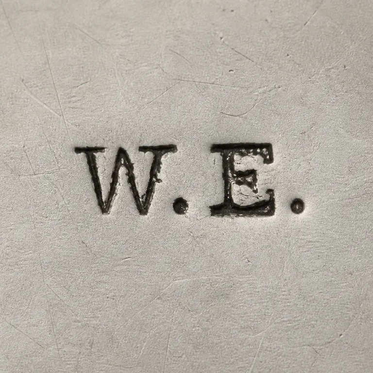 William Ehrhardt William Ehrhardt Ltd (from c1910): Preserves the separated W-like and E-like forms, two separator dots, proportions, spacing, and orientation; oxidized reconstruction.