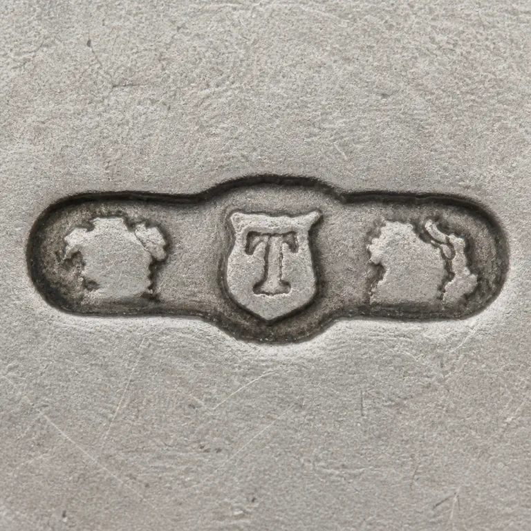 The Thomae Company: crown, T, lion; oxidized reconstruction.