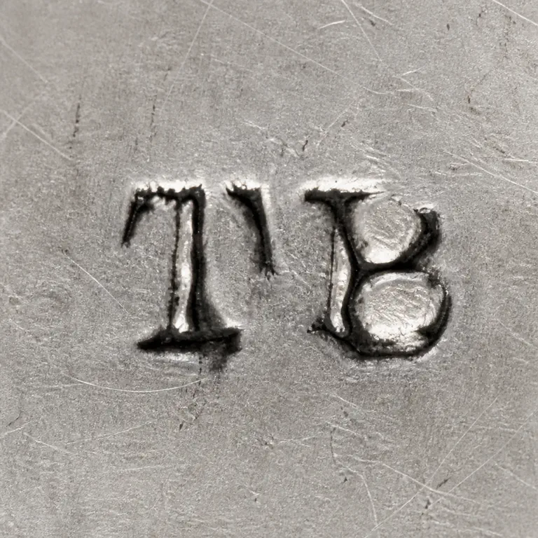 Thomas Bligh: Source-bounded low-confidence contour preserves the visible mark geometry and supported lettering or device; oxidized reconstruction.