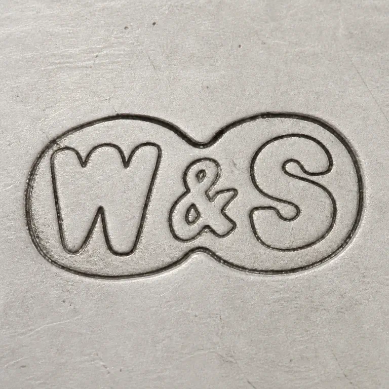 Wilson & Sharp subsequently Wilson & Sharp Ltd: Preserves W, one ampersand-like separator, and S in order within the worn shared punch boundary; oxidized reconstruction.