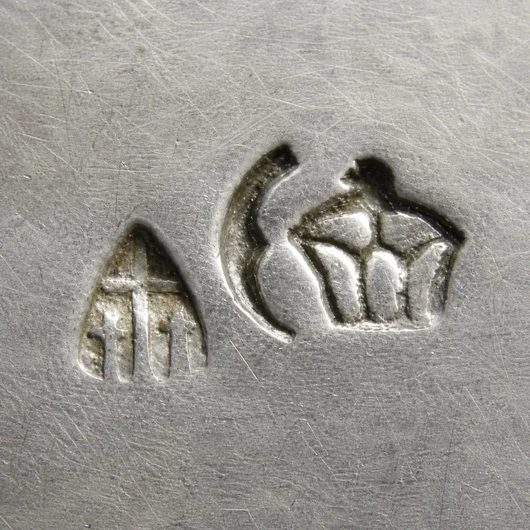 Richard Köberlin: Two separated worn punch shapes; oxidized reconstruction.
