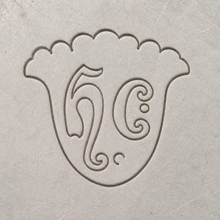 Harold Child: The ornate shield or crest boundary and H/C-like internal forms; oxidized reconstruction.