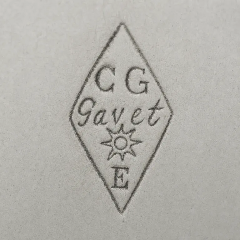 Maison Cardeilhac: Tall diamond punch with C G at top, Gavet script across center, a sun below, and E at bottom; oxidized reconstruction.