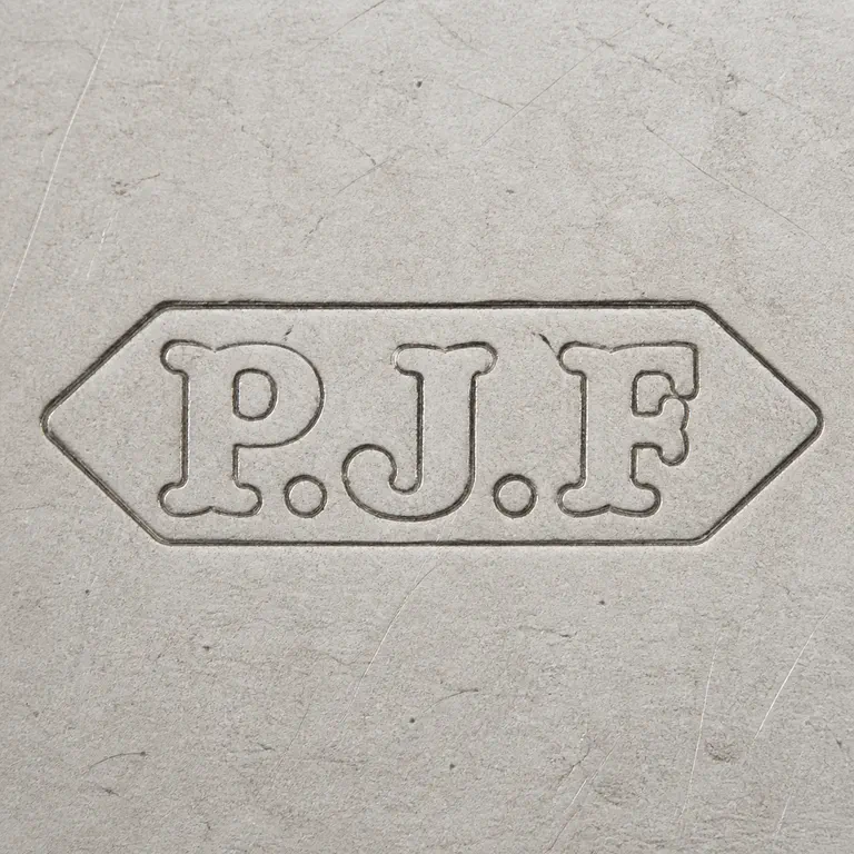 Percy James Finch: A pointed punch with P.J.F forms and punctuation is reconstructed hexagonal outline; oxidized reconstruction.
