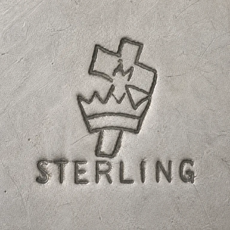Manchester Silver Co.: manchester sterling · M, crown, cross; oxidized reconstruction.