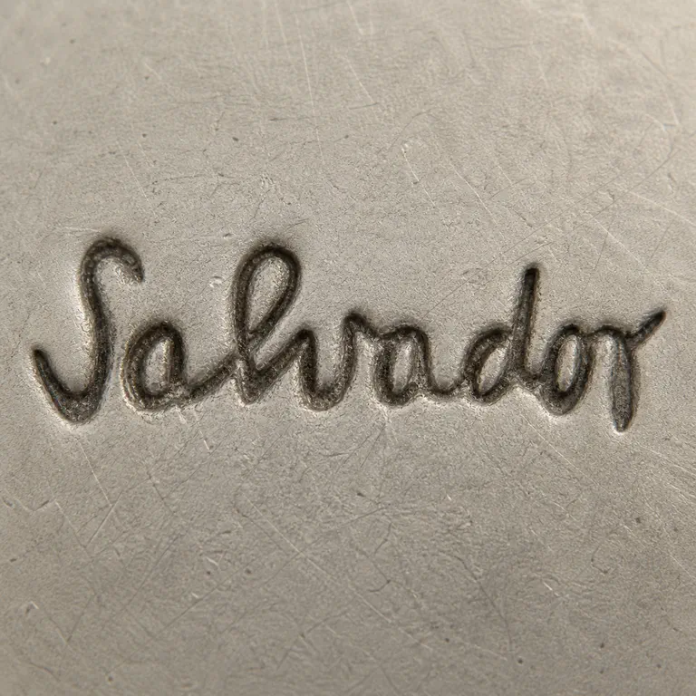 Salvador Teran Marks, Bio & Work Examples: One unbordered connected cursive Salvador wordmark without block-type substitution; oxidized reconstruction.