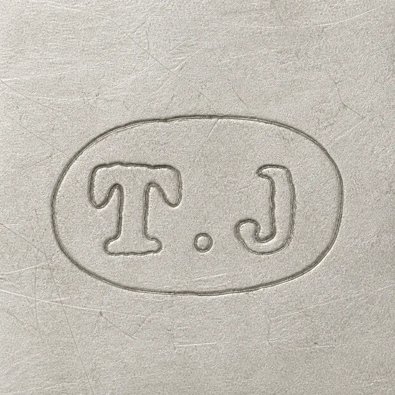 Thomas Johnson II: Source-linked T/J-like two-form grouping and centered rounded oval boundary retained; oxidized reconstruction.