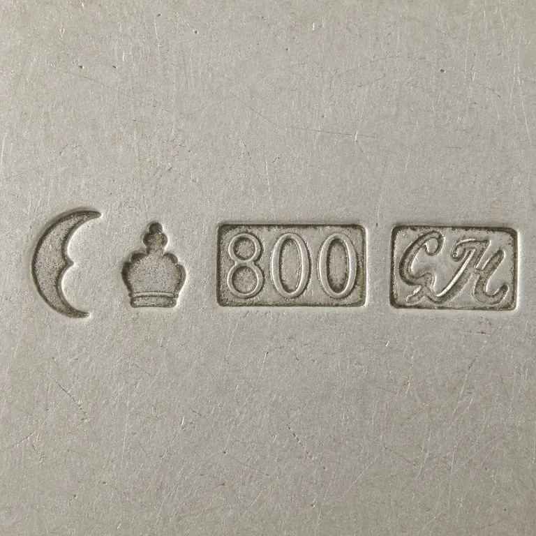 looking for info: Visible text, numerals, symbol order, and source-bounded device geometry; oxidized reconstruction.