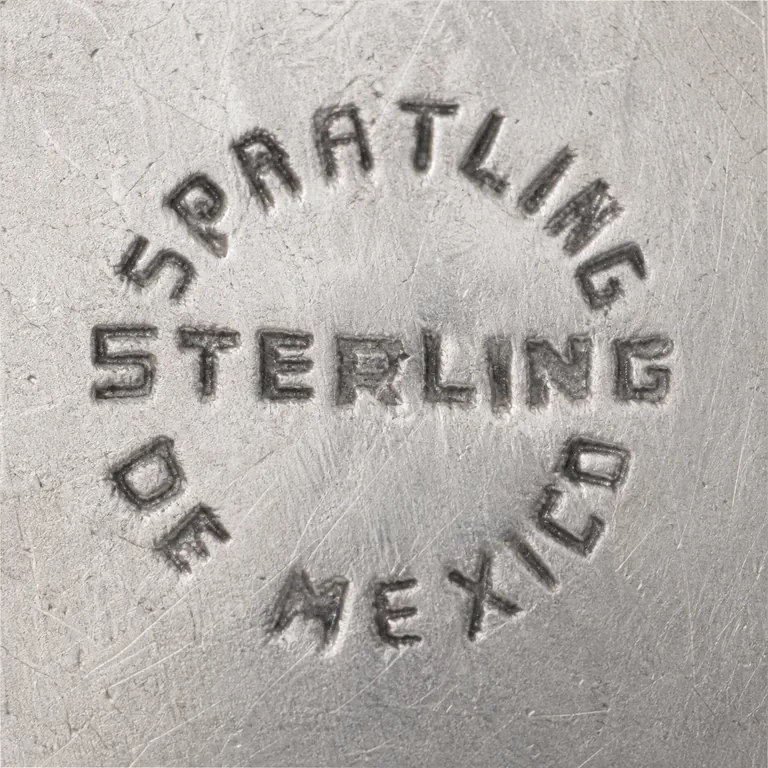 Spratling de Mexico: Unenclosed circular layout preserves SPRATLING above, STERLING centrally, and DE MEXICO below; oxidized reconstruction.