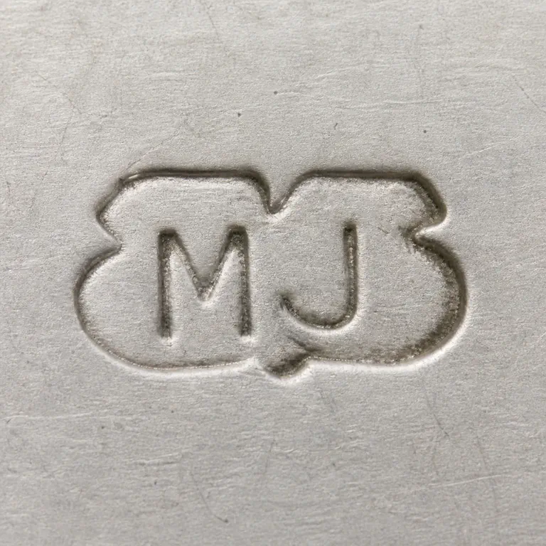 M J: An irregular rounded outer punch containing supported M and J forms is reconstructed asymmetric source boundary; oxidized reconstruction.