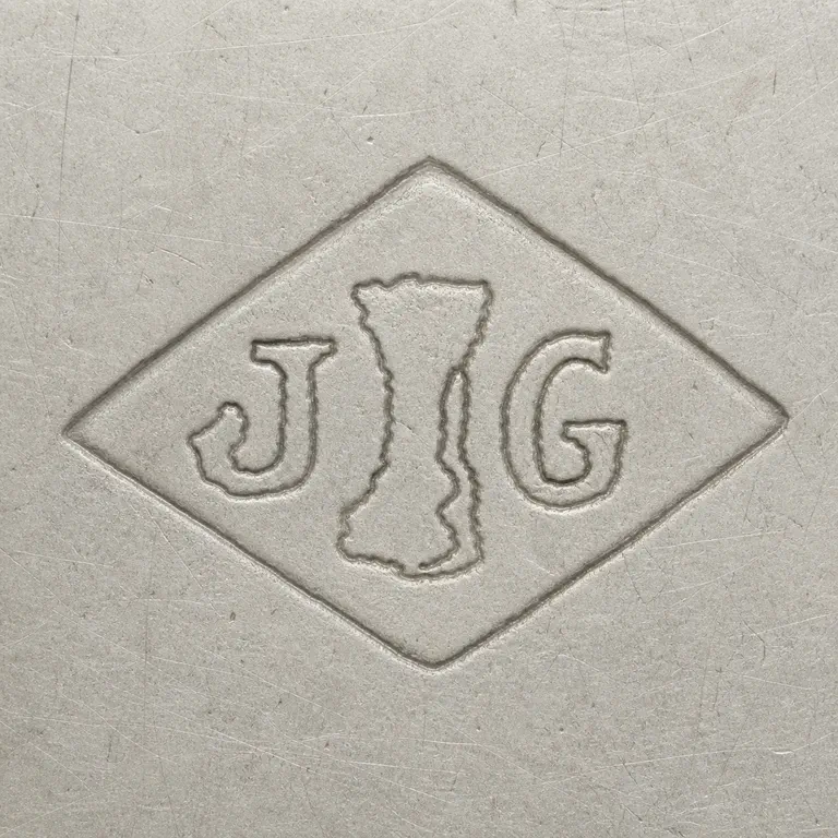 Joseph Antoine: Horizontal diamond punch with J left, G right, and one tall irregular central device; oxidized reconstruction.