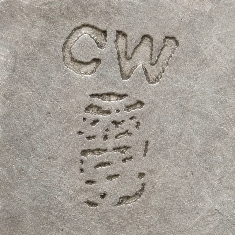 SILVERSMITH: CW remains at the top with no invented divider; the lower portion is kept as a compact vertical field of unresolved worn fragments rather…; oxidized reconstruction.