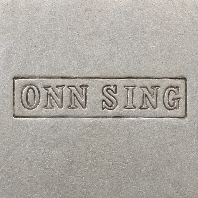 SILVERSMITH: Uppercase ONN SING inside exactly one long rectangular enclosure doubled photographic rim removed; oxidized reconstruction.