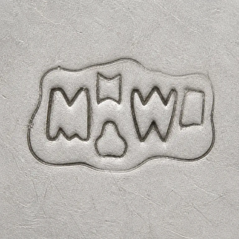 Mappin & Webb Ltd: Conservative retry retained the two-row arrangement, broad upper and lower silhouettes, irregular local boundary without fine invented de…; oxidized reconstruction.