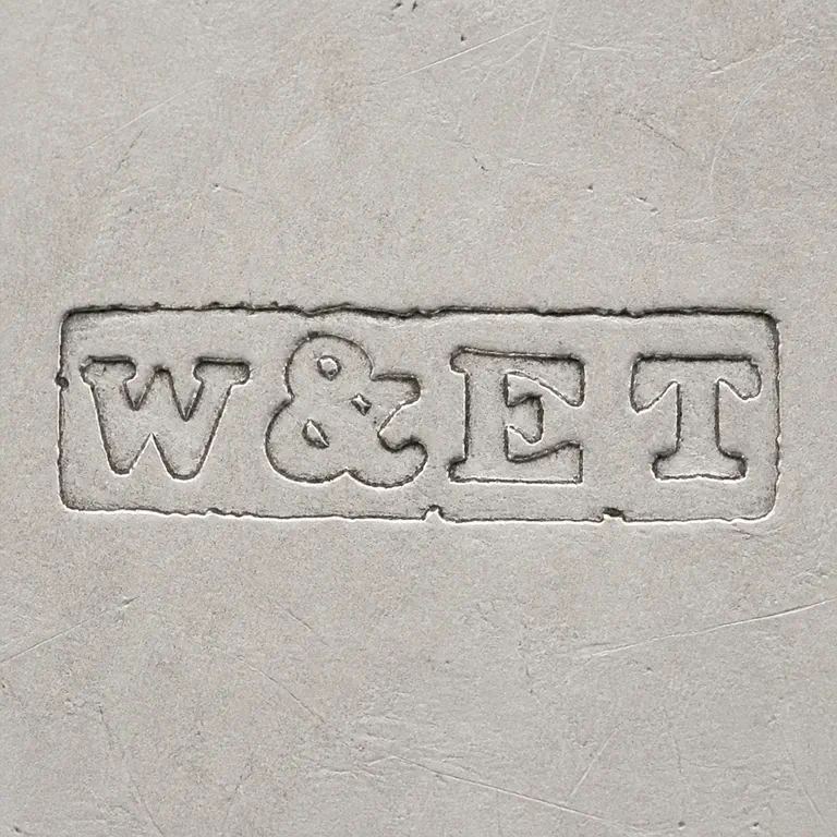 William & Edward Turnpenny: Square reconstruction preserves W, ampersand-like group, E-like group, and T-like group within one long rough rectangular punch, with sou…; oxidized reconstruction.