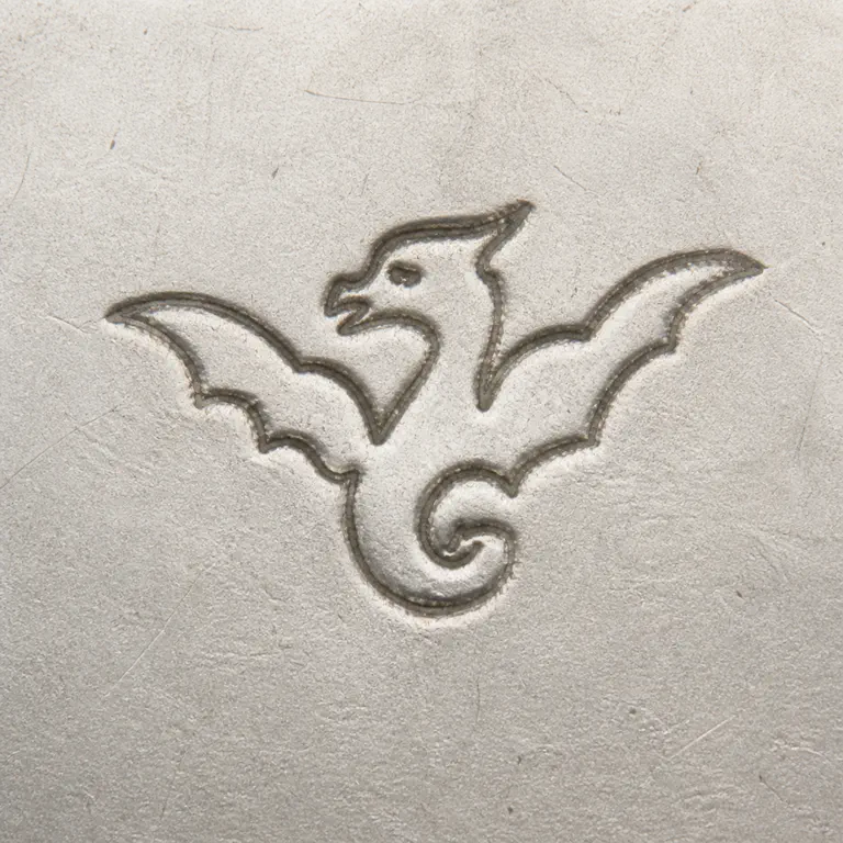 The Merrill Shops: winged dragon; oxidized reconstruction.