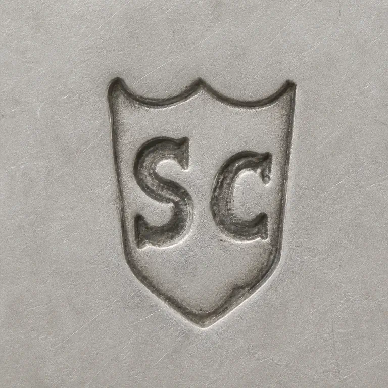 Sc: Preserves the shield-like outer border with twin upper points, the separated S/C-like inner forms, their order, source orientation withou…; oxidized reconstruction.