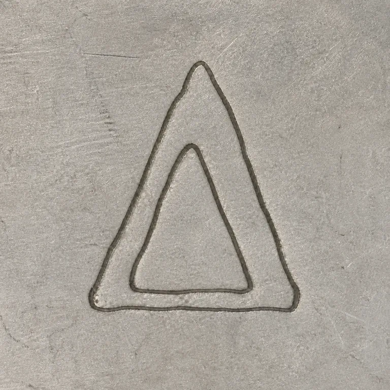 St. Petersburg: One isolated hollow triangular delta-like glyph; oxidized reconstruction.