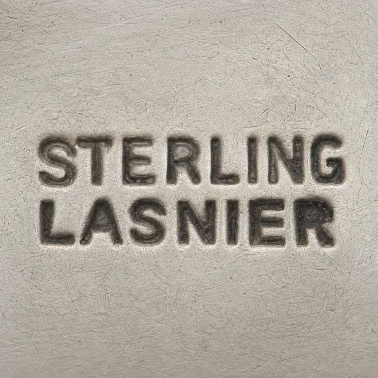 Jean Lasnier (b.1923): Two uppercase lines, STERLING above LASNIER; oxidized reconstruction.