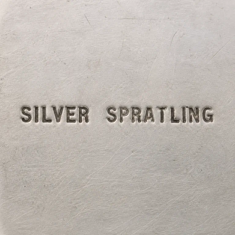 Inline Mark: One unenclosed horizontal line preserves exact SILVER SPRATLING wording; oxidized reconstruction.