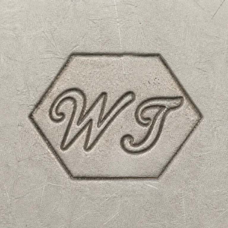William Turner (Master Cutlers) Ltd: Capital W and T inside one single hexagonal/clipped-corner cartouche; oxidized reconstruction.