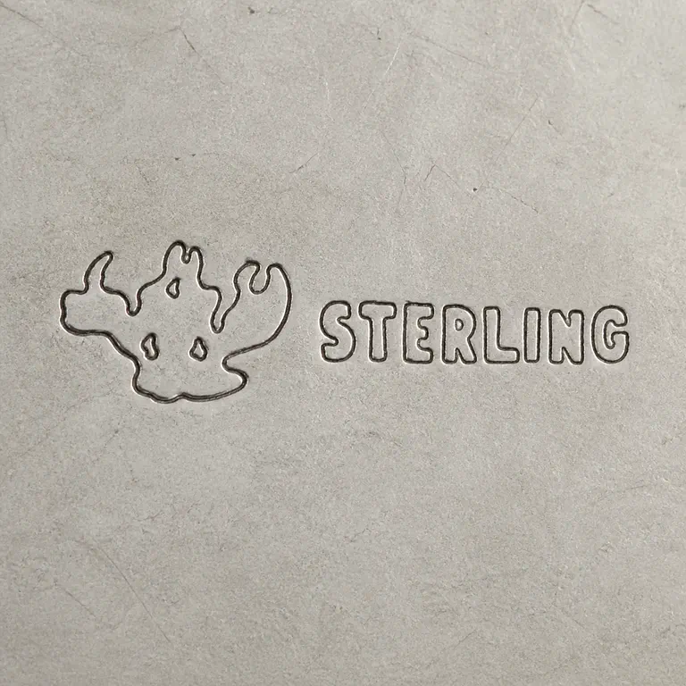 Jacoby Brothers Ltd.: One compact unresolved three-lobed abstract device with three small internal voids followed by STERLING; oxidized reconstruction.
