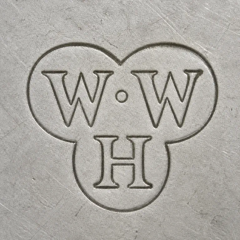 W. W. Harrison & Co.: Uppercase W, one centered dot, and uppercase W on the upper tier with uppercase H centered below, arranged W·W / H inside one compact thr…; oxidized reconstruction.