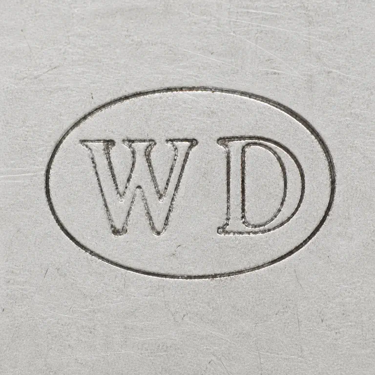 William Dyer: Visible W and D glyphs in order inside one continuous oval cartouche; oxidized reconstruction.