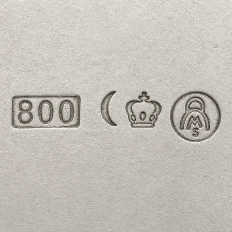 Julius Lemor: 800 cartouche, crescent, crown, and circular MS emblem; oxidized reconstruction.