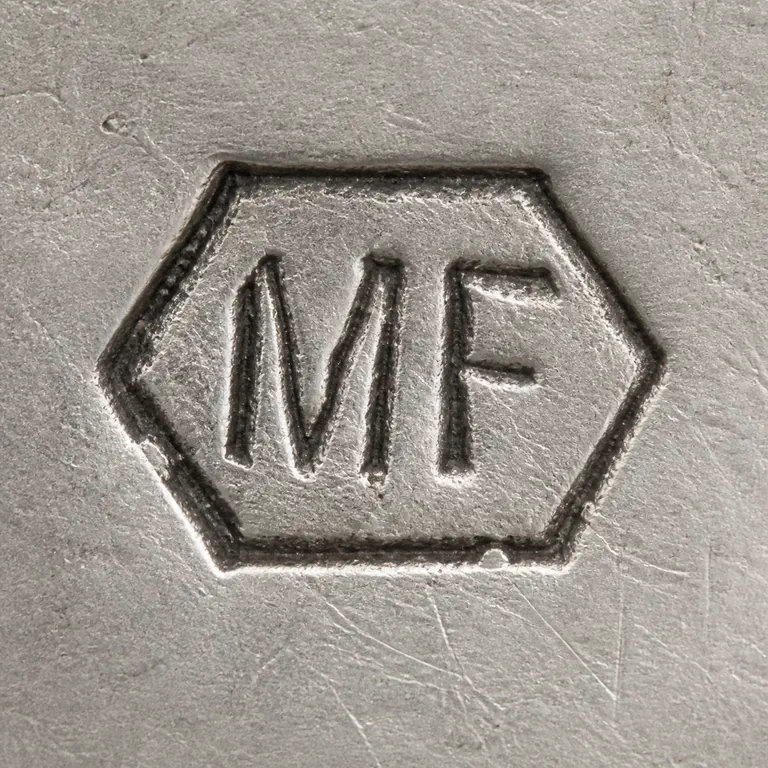 Maurice Flixher: Clean redraw preserves the MF lettering supported hexagonal border; oxidized reconstruction.