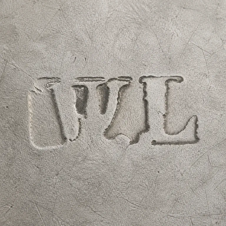 William Lestourgeon: Sparse distressed lower W/L-like forms with only a few supported upper strokes retained; oxidized reconstruction.